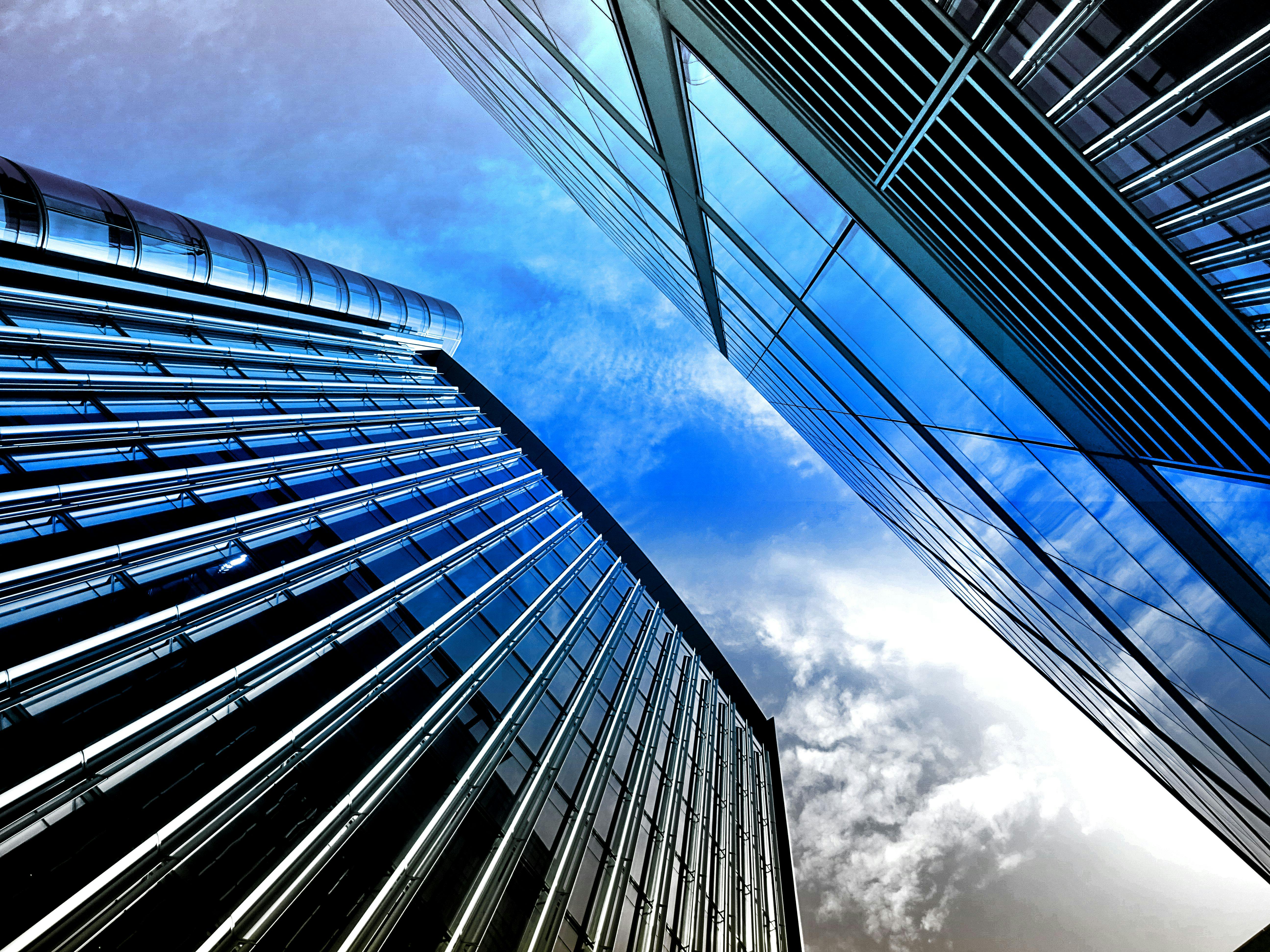 worms eye view of sky between two skyscrapers